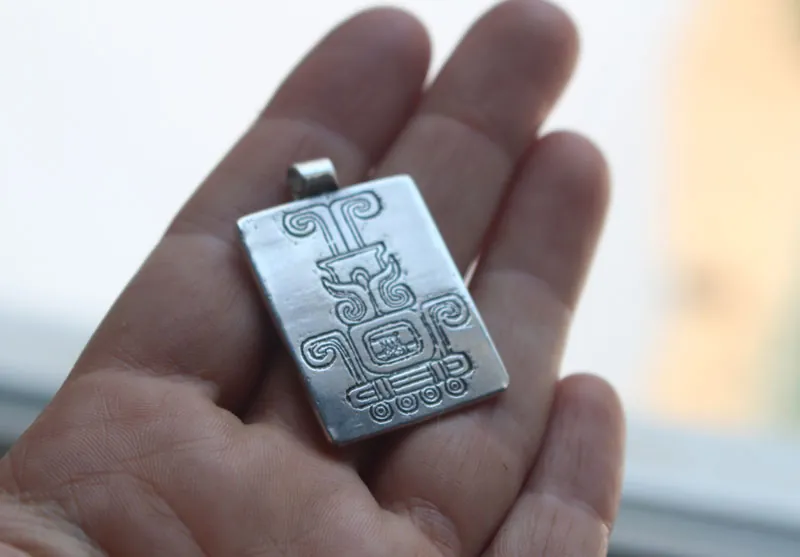Sacred fire, Mexican Aztec glyph necklace in silver