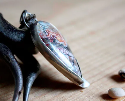 Sayap, dragon wing pendant in silver and Mexican Crazy Lace agate