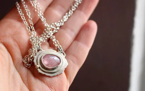 Supernova sapphire, astronomy necklace in silver, gold, and pink sapphire