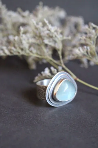 The blue of the waves, sea movement ring in silver and fluorite