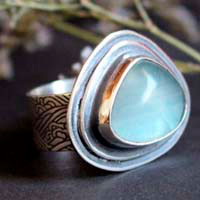 The blue of the waves, sea movement ring in silver and fluorite