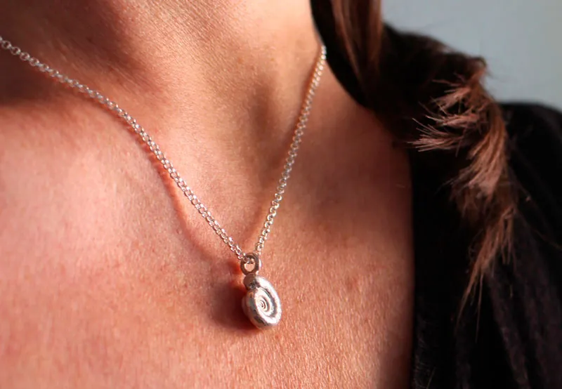 The cradle of life, nautilus Ammonite and birthstone necklace in silver and ruby