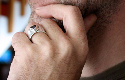 The druid’s ring, Celtic ring in silver, brass and garnet