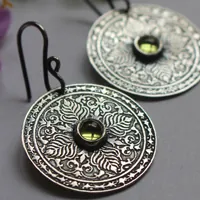 The earth, terrestrial mandala earrings in silver and peridot