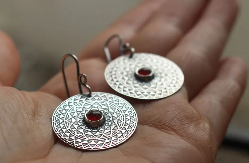 The fire, fiery mandala earrings in silver and carnelian
