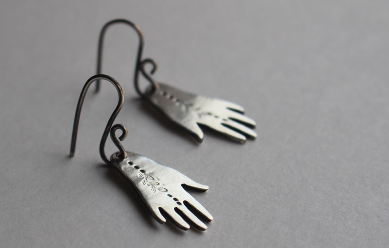 The gift of gaia, hand and leaf earrings in sterling silver