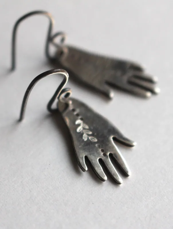 The gift of gaia, hand and leaf earrings in sterling silver