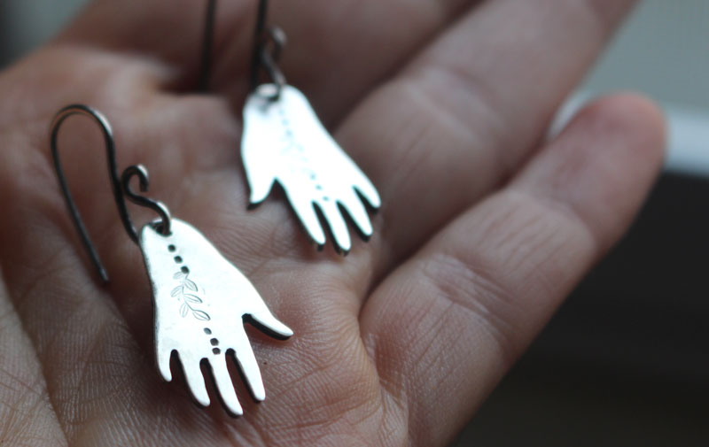 The gift of gaia, hand and leaf earrings in sterling silver