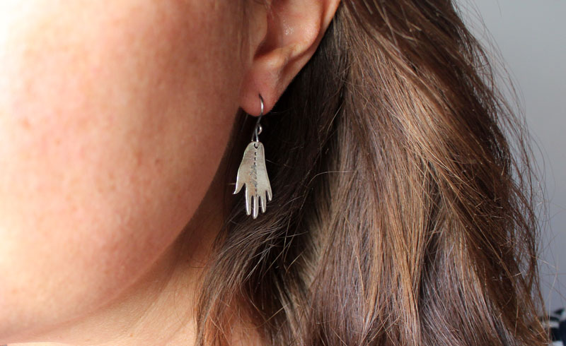The gift of gaia, hand and leaf earrings in sterling silver