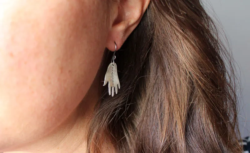 The gift of gaia, hand and leaf earrings in sterling silver