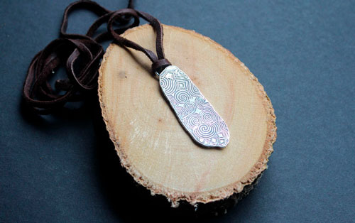 The guardian stone of Newgrange, Neolithic stele from Ireland pendant in silver