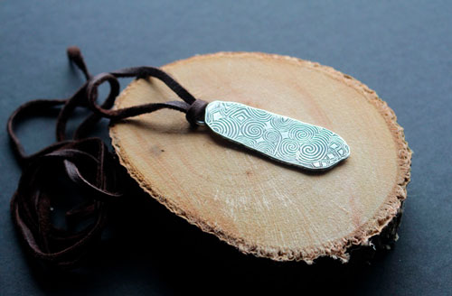 The guardian stone of Newgrange, Neolithic stele from Ireland pendant in silver