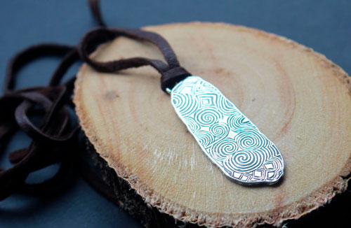 The guardian stone of Newgrange, Neolithic stele from Ireland pendant in silver