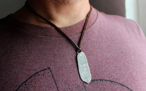 The guardian stone of Newgrange, Neolithic stele from Ireland pendant in silver