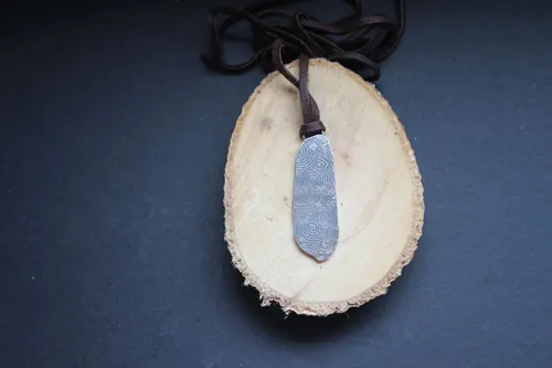 The guardian stone of Newgrange, Neolithic stele from Ireland pendant in silver