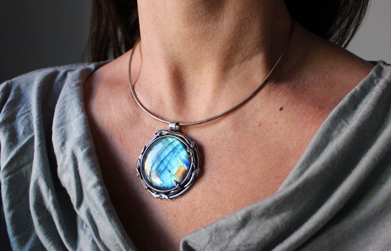The reflection of the sky, leaves and branches pendant in silver and labradorite