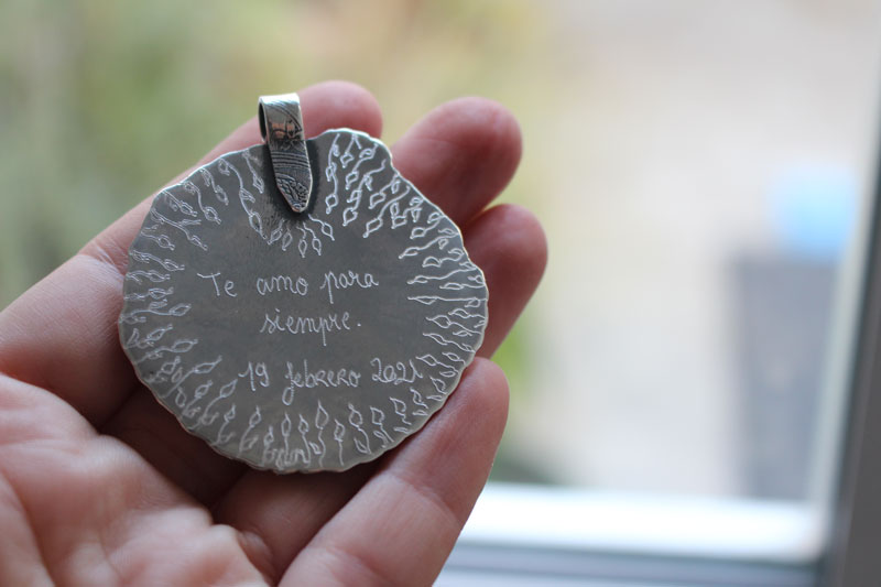 The reflection of the sky, leaves and branches pendant in silver and labradorite