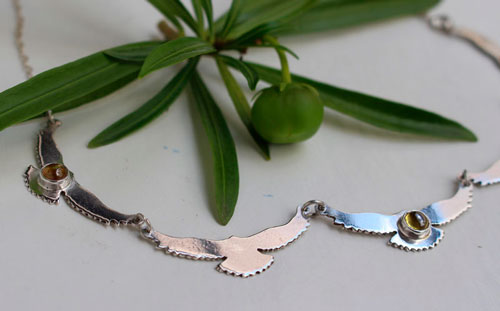 The song of the sun, bird necklace in silver and yellow zircon