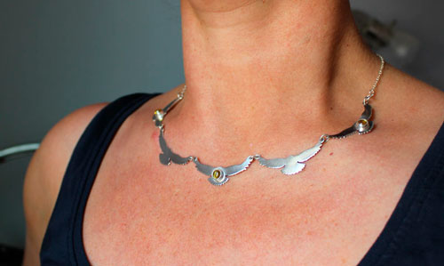 The song of the sun, bird necklace in silver and yellow zircon