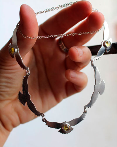 The song of the sun, bird necklace in silver and yellow zircon