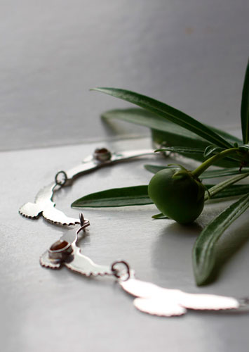 The song of the sun, bird necklace in silver and yellow zircon