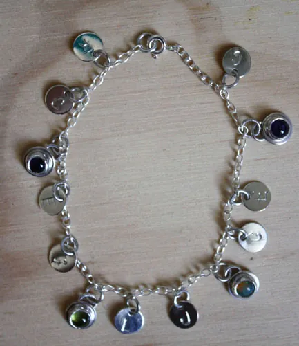 The tree of Jesse, family keepsake bracelet in silver, amethyst, opal, and peridot