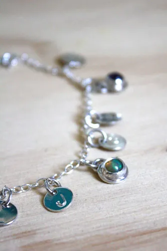 The tree of Jesse, family keepsake bracelet in silver, amethyst, opal, and peridot
