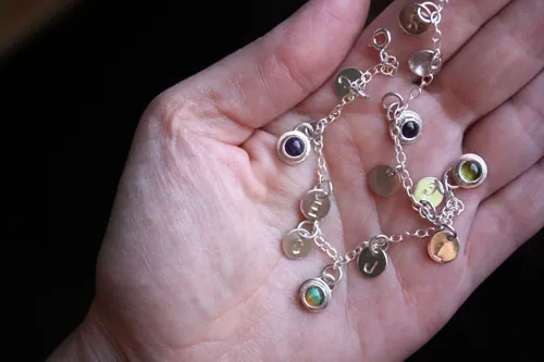 The tree of Jesse, family keepsake bracelet in silver, amethyst, opal, and peridot