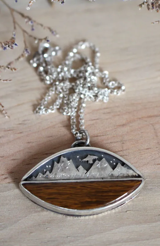 To the heavens, mountain eagle necklace in silver and fossilized wood