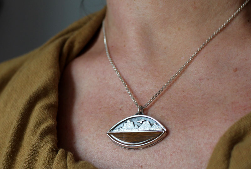 To the heavens, mountain eagle necklace in silver and fossilized wood