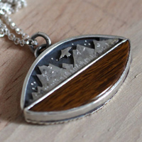To the heavens, mountain eagle necklace in silver and fossilized wood