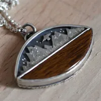 To the heavens, mountain eagle necklace in silver and fossilized wood