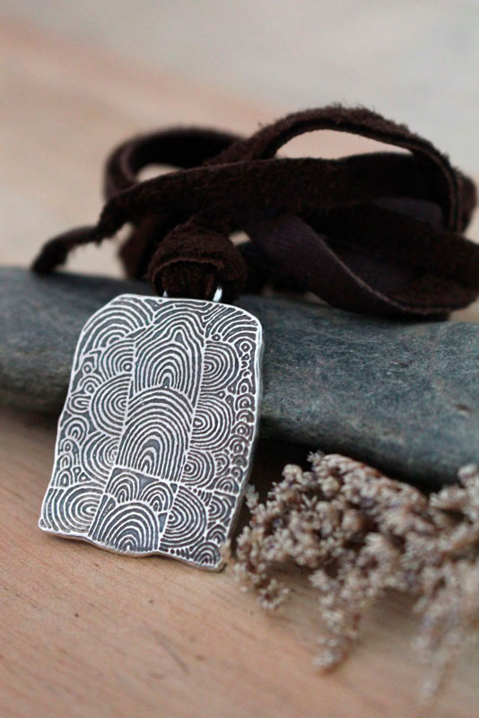 The cairn of Gavrinis, spiral Neolithic engraved stone necklace in silver