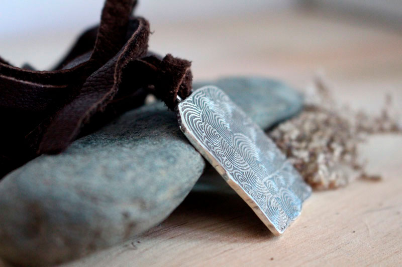 The cairn of Gavrinis, spiral Neolithic engraved stone necklace in silver