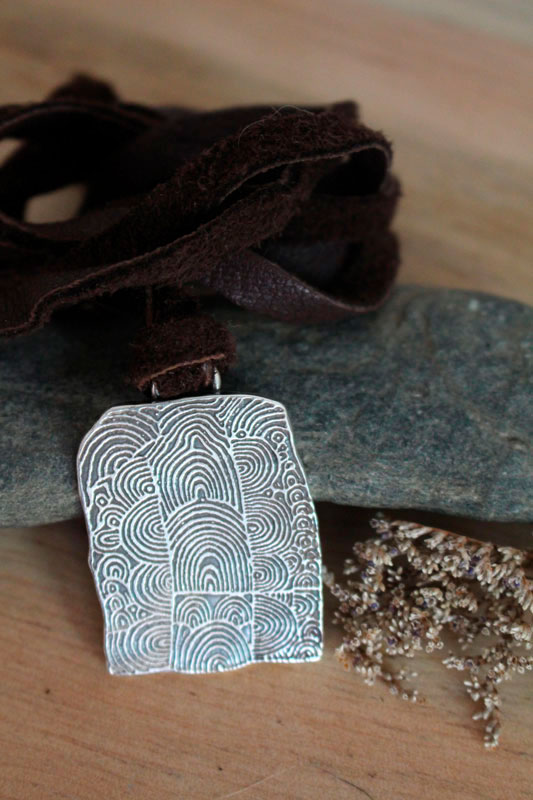 The cairn of Gavrinis, spiral Neolithic engraved stone necklace in silver