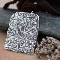 The cairn of Gavrinis, spiral Neolithic engraved stone necklace in sterling silver