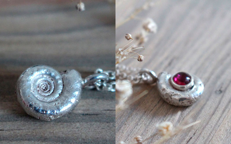 The cradle of life, nautilus ammonite necklace in sterling silver and ruby