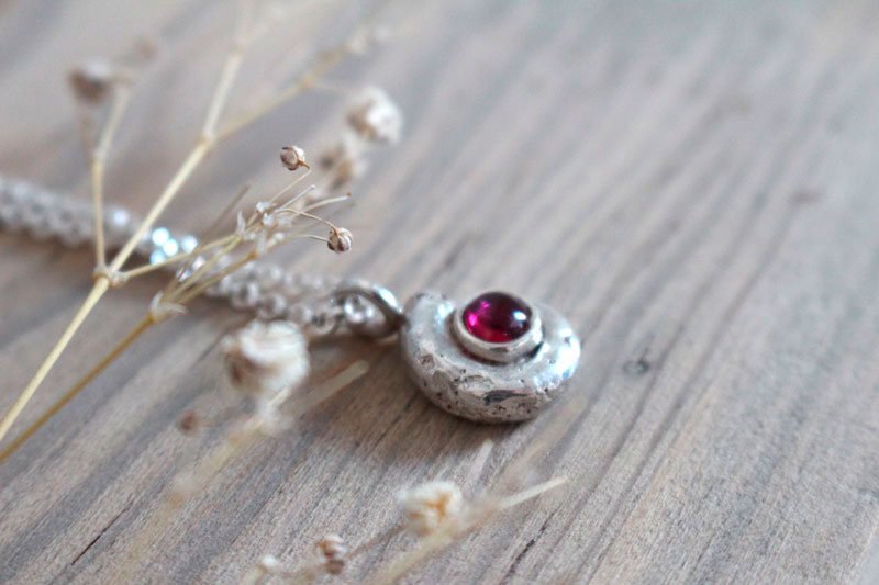 The cradle of life, nautilus ammonite necklace in sterling silver and ruby