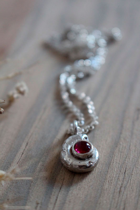 The cradle of life, nautilus ammonite necklace in sterling silver and ruby