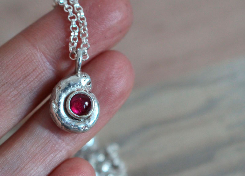 The cradle of life, nautilus ammonite necklace in sterling silver and ruby