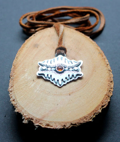 The eye of the earth, tribal mountain necklace in silver and amber