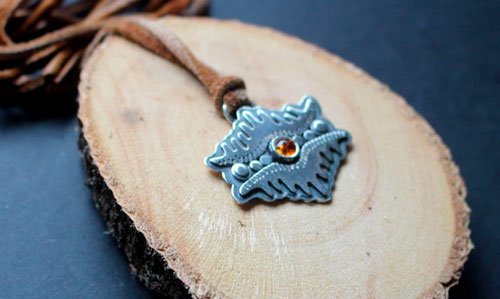 The eye of the earth, tribal mountain necklace in silver and amber