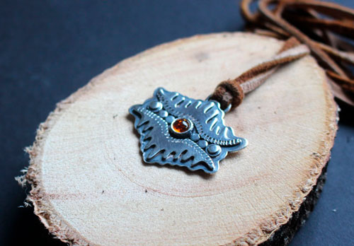 The eye of the earth, tribal mountain necklace in silver and amber