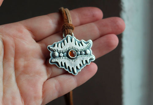 The eye of the earth, tribal mountain necklace in silver and amber