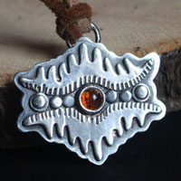 The eye of the earth, tribal mountain necklace in sterling silver and amber