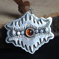 The eye of the earth, tribal mountain necklace in silver and amber