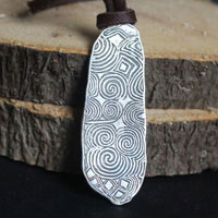 The stone guard of Newgrange, Irish Neolithic stele necklace in silver