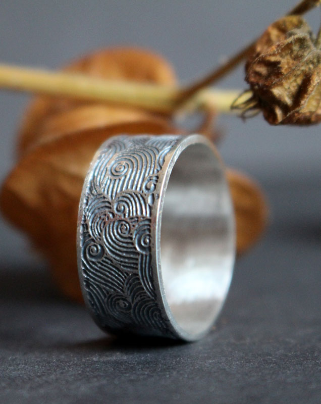 The wind, air symbol ring in sterling silver