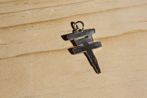 Tokio Hotel, the pop rock band’s cross logo pendant in sterling silver