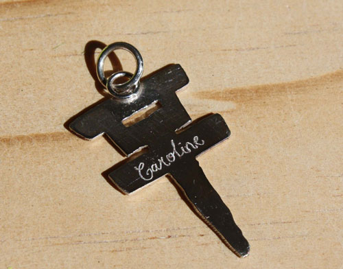 Tokio Hotel, the pop rock band’s cross logo pendant in sterling silver